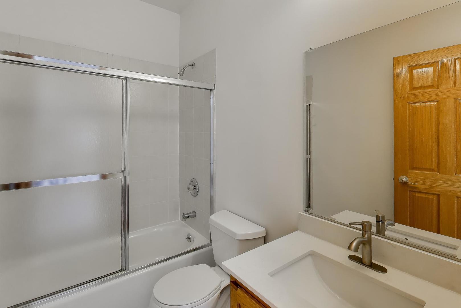 16W234 91st Street Burr Ridge, IL 60527 - Photo 39 of 50 a bathroom with a sink toilet and shower