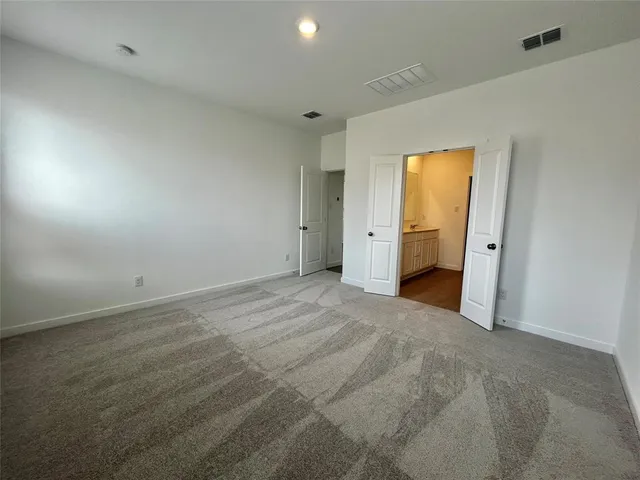 a bathroom with a double vanity sink and mirror