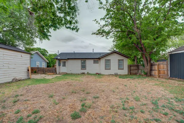 a house with trees in the background