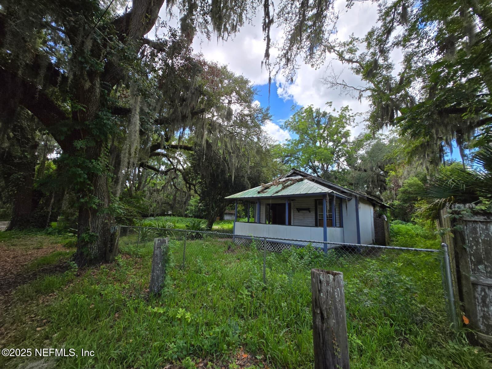 1336 Hogan Lane Jacksonville, FL 32221 - Photo 1 of 7 a house that has a tree in it