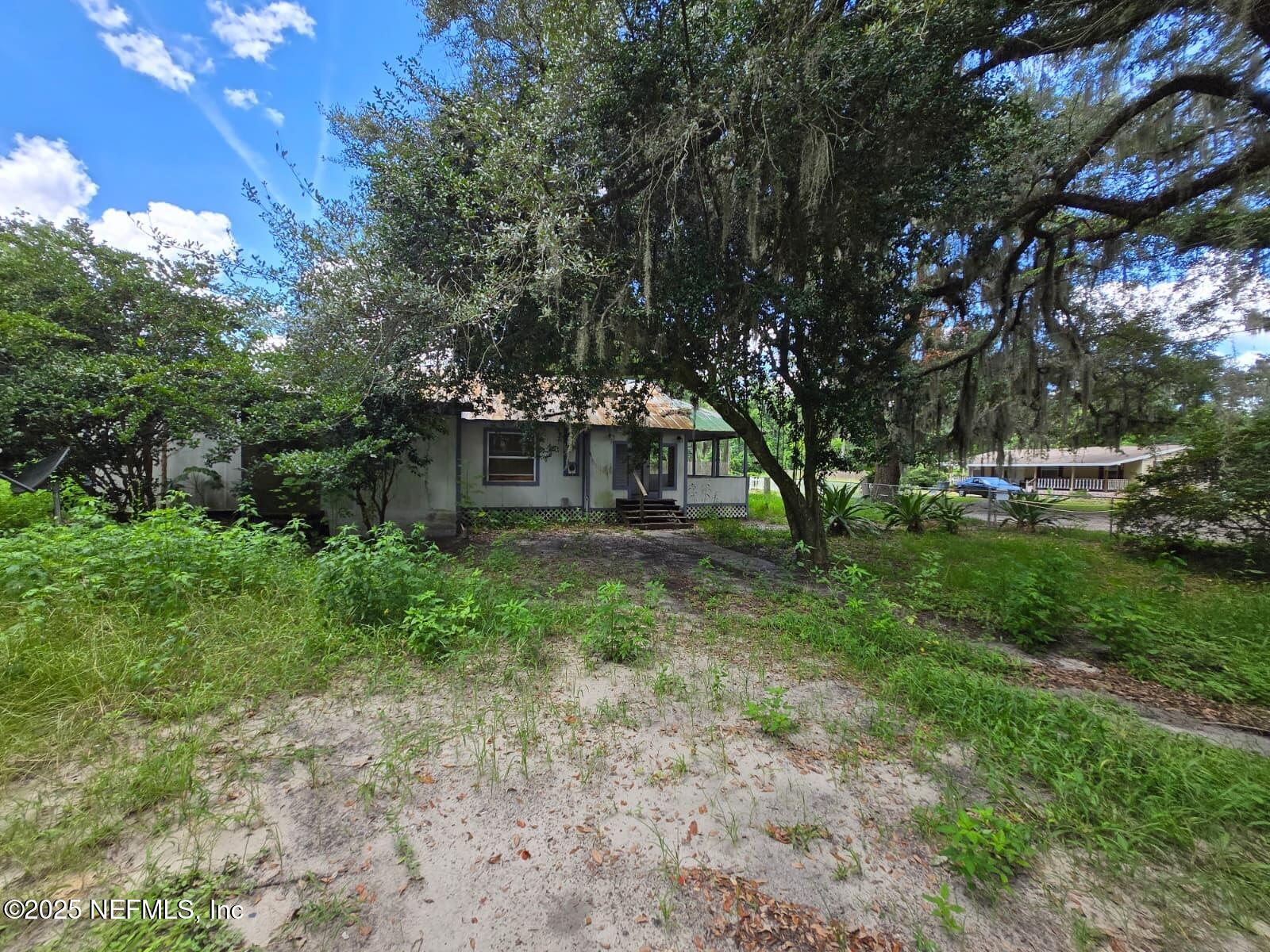 1336 Hogan Lane Jacksonville, FL 32221 - Photo 3 of 7 a front view of a house with garden
