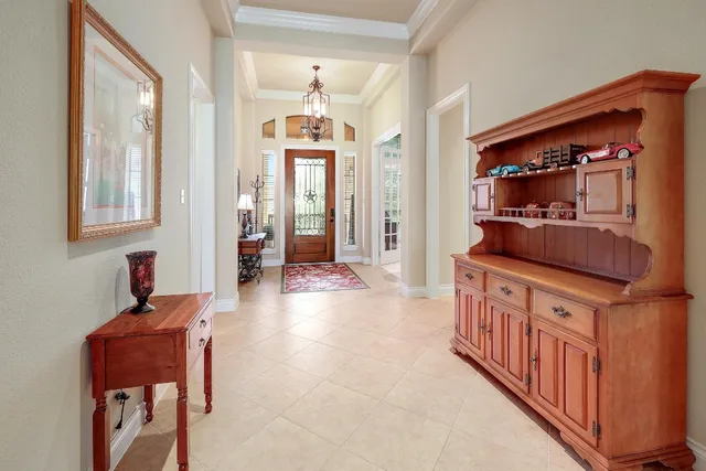 a kitchen with stainless steel appliances kitchen island granite countertop a table and chairs in it