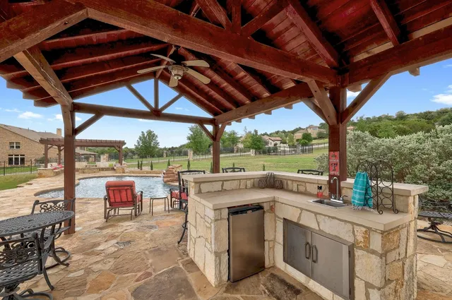 a view of a swimming pool with a patio