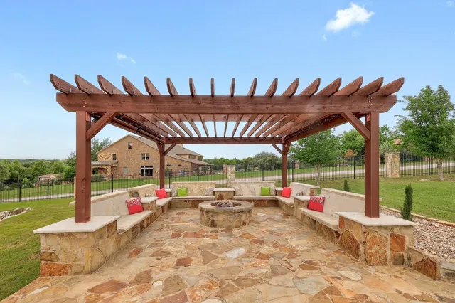 an aerial view of a house with a garden and lake view