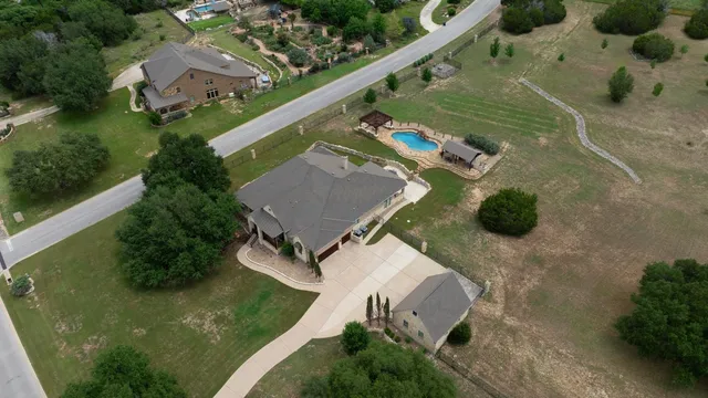 an aerial view of a house with a garden