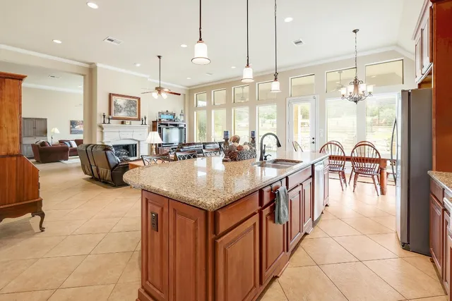a kitchen with counter space and breakfast area