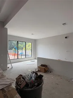 a bed sitting in a room next to a window