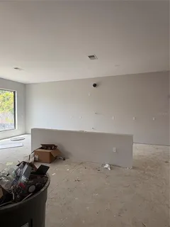 a kitchen with a stove and a window