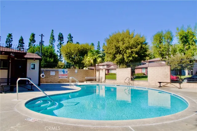 a view of a swimming pool with a patio