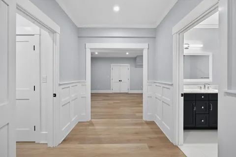 a view of a hallway with front door