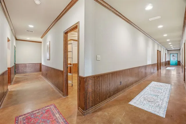 a view of gallery with wooden floor