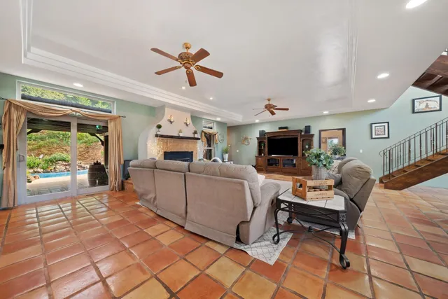 a spacious bathroom with a granite countertop sink and a mirror