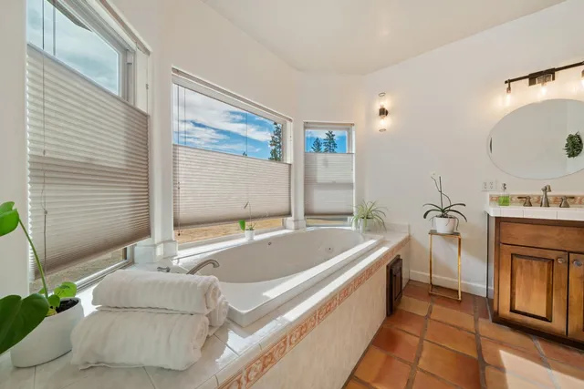 a bathroom with a bathtub and a shower