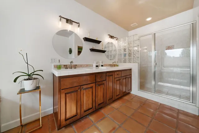 a spacious bedroom with a bed and a large window