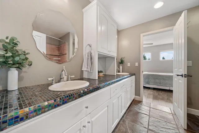 a view of a house with backyard porch and sitting area
