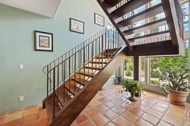 a kitchen with stainless steel appliances granite countertop a sink and a counter top space