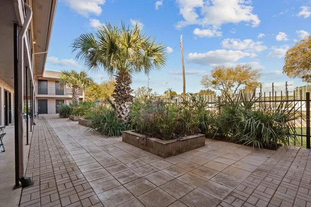 an aerial view of a house with a garden and a yard