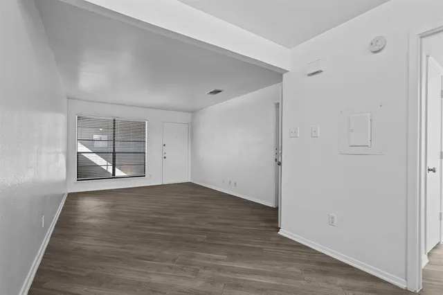 a kitchen with a refrigerator and a sink