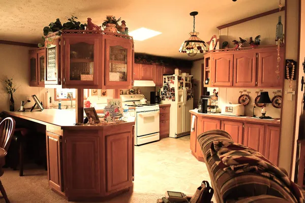 a view of a kitchen with a sink and cabinets