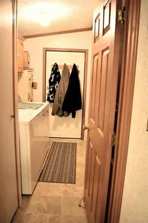 a view of a bathroom with a sink and mirror