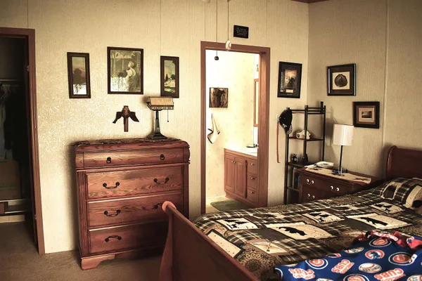 a view of a livingroom with furniture and a flat screen tv