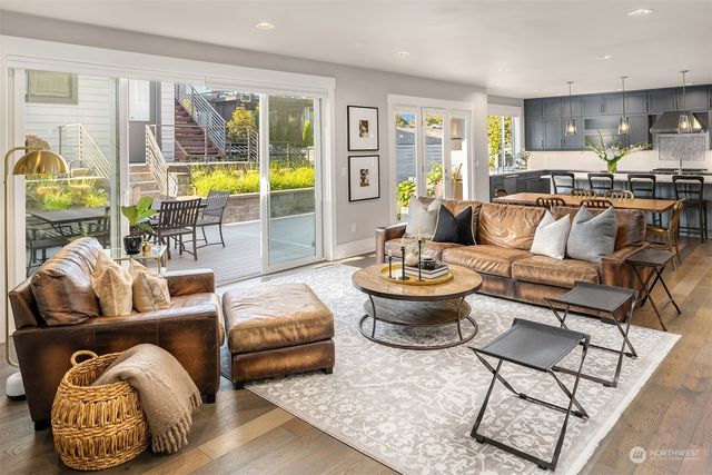a living room with furniture and kitchen view
