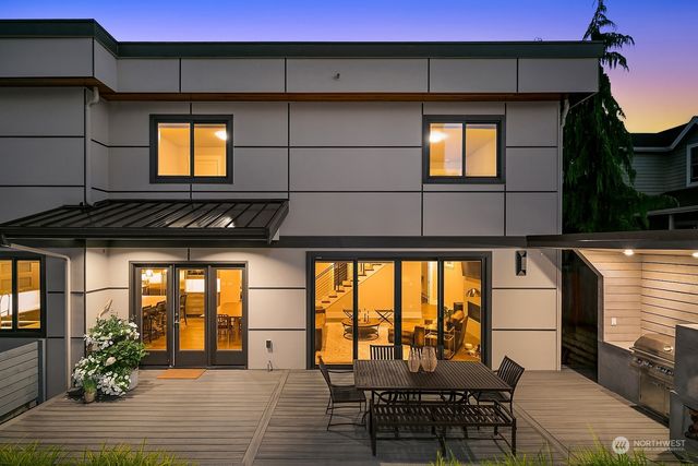a balcony with table and chairs