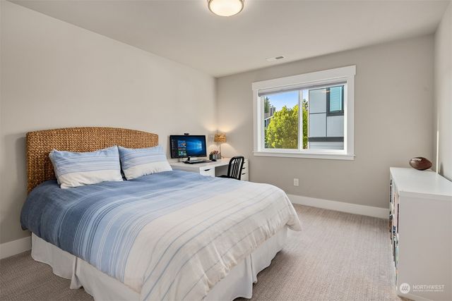 a bathroom with double sink and a mirror