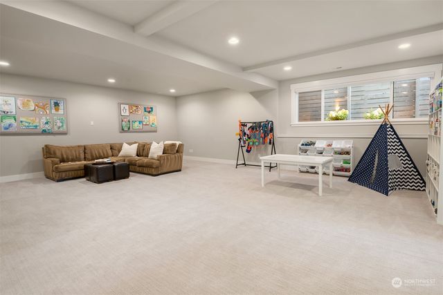 a living room with furniture and white walls