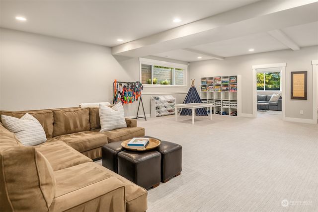 a view of a livingroom with furniture and a flat screen tv