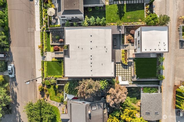 aerial view of a house with street