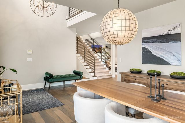 a dining table with chairs and wooden floor
