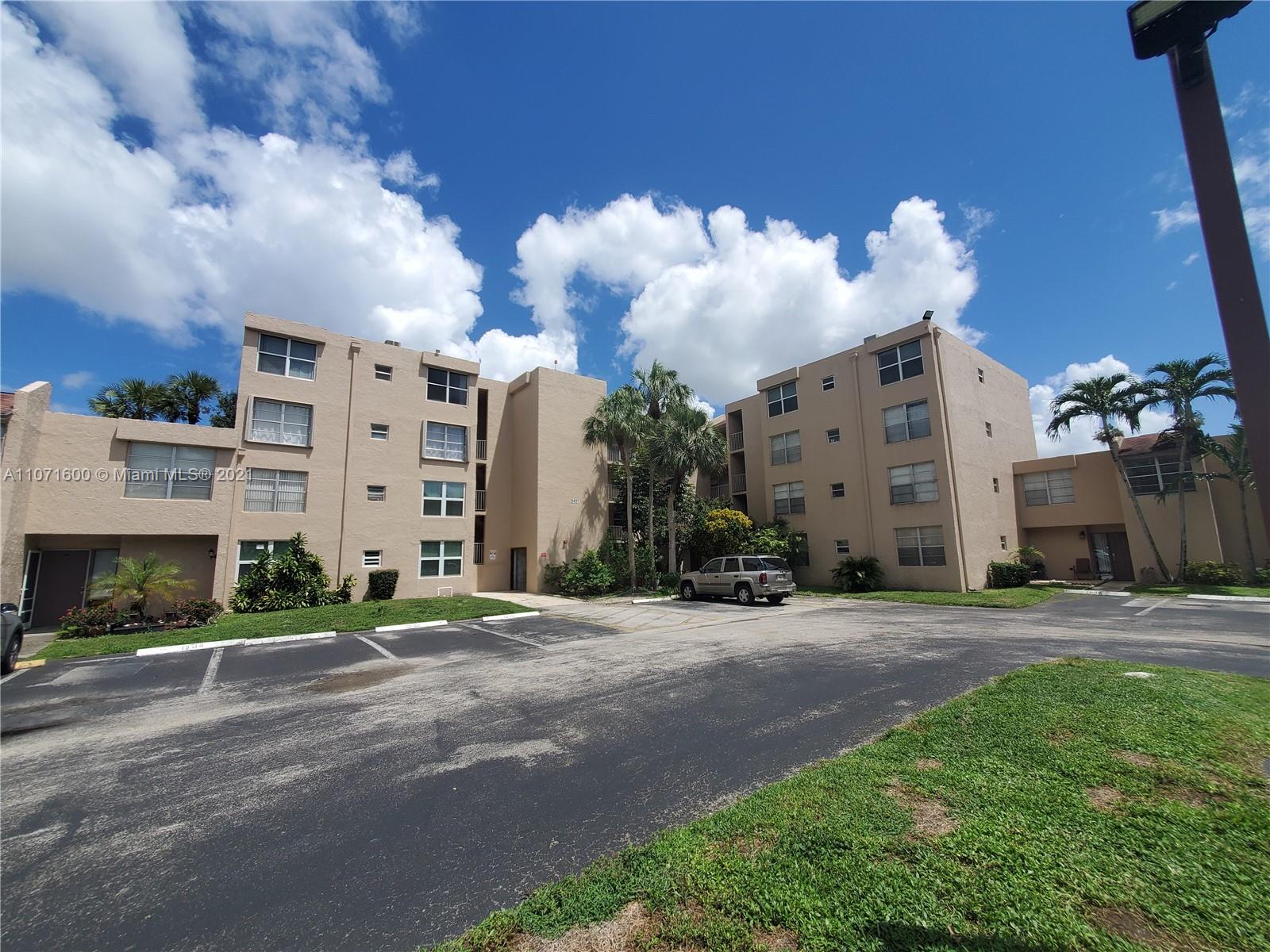 9431 Live Oak Place, Unit 108 Davie, FL 33324 - Photo 23 of 27 a view of a building with a street