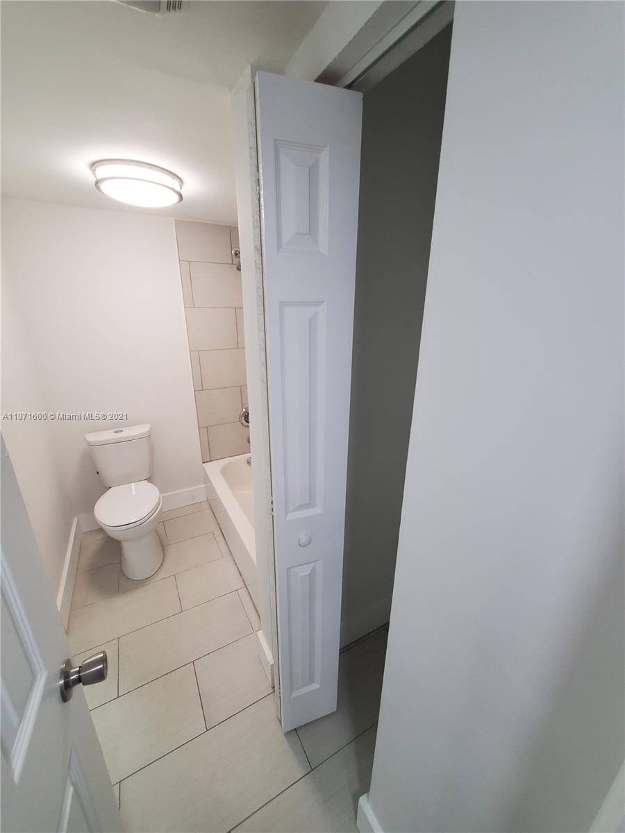 9431 Live Oak Place, Unit 108 Davie, FL 33324 - Photo 6 of 27 a bathroom with a sink and a mirror