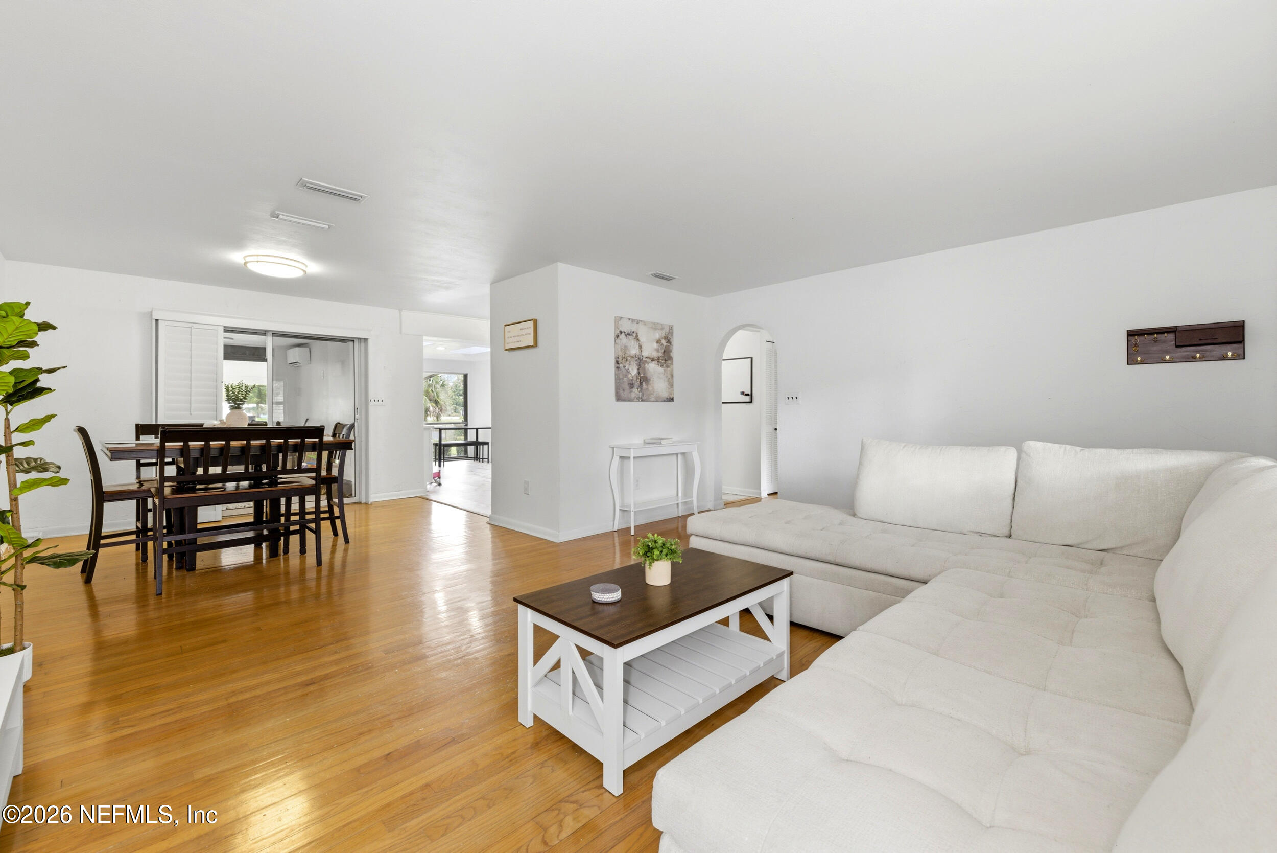 7484 Spinola Road Jacksonville, FL 32217 - Photo 12 of 63 a living room with furniture and wooden floor