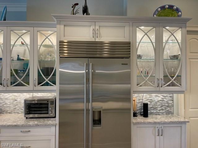 2067 Mission Drive Naples, FL 34109 - Photo 13 of 43 a kitchen with a refrigerator a stove and a sink