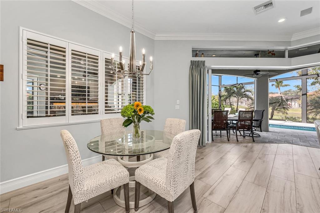 2067 Mission Drive Naples, FL 34109 - Photo 16 of 43 a view of a dining room with furniture window and outside view
