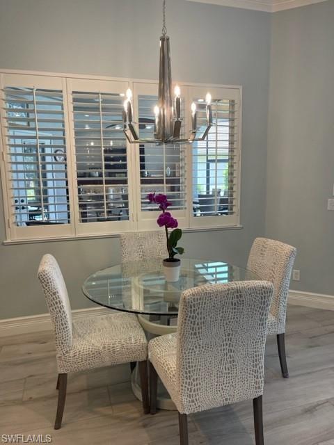 2067 Mission Drive Naples, FL 34109 - Photo 17 of 43 a dining room with furniture and window