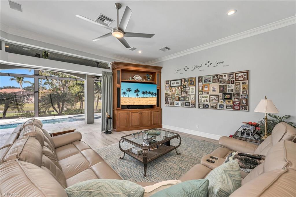 2067 Mission Drive Naples, FL 34109 - Photo 19 of 43 a living room with furniture and a large window