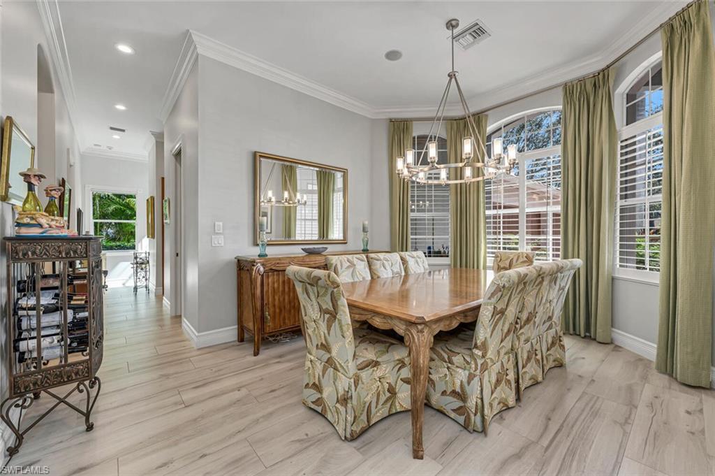 2067 Mission Drive Naples, FL 34109 - Photo 20 of 43 a dining room with furniture window wooden floor