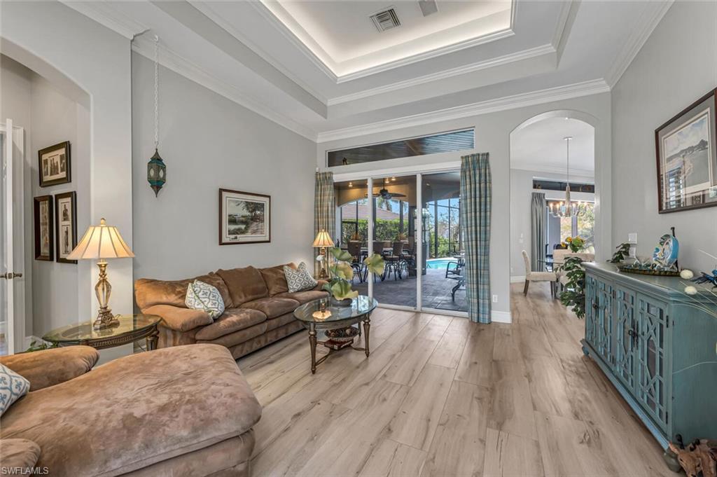 2067 Mission Drive Naples, FL 34109 - Photo 21 of 43 a living room with furniture and a wooden floor