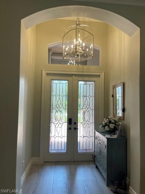 2067 Mission Drive Naples, FL 34109 - Photo 22 of 43 a view of an entryway with wooden floor