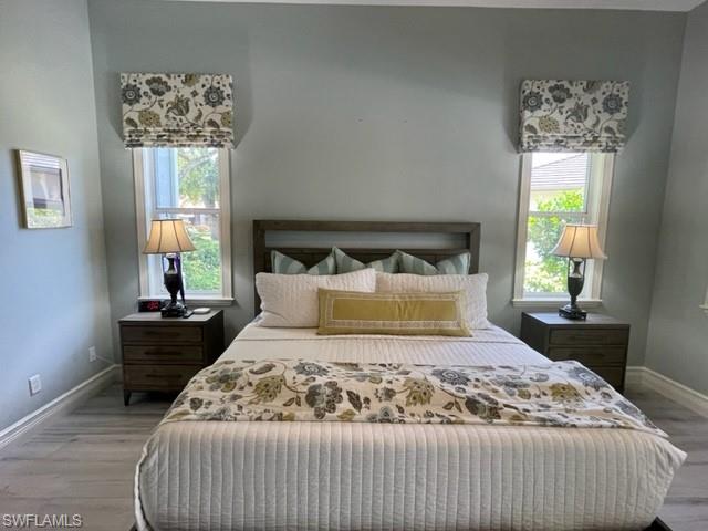 2067 Mission Drive Naples, FL 34109 - Photo 25 of 43 a bedroom with a large bed and a window