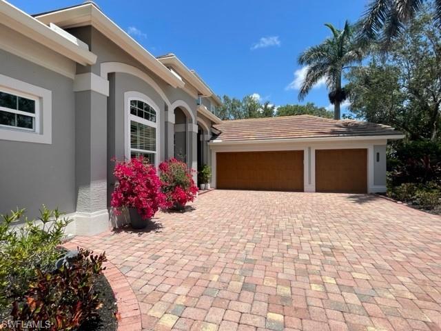 2067 Mission Drive Naples, FL 34109 - Photo 36 of 43 a view of a house with a yard and potted plants