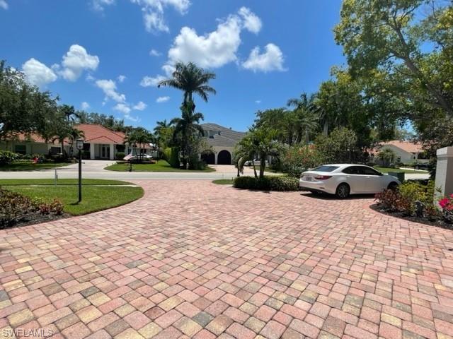 2067 Mission Drive Naples, FL 34109 - Photo 37 of 43 a car parked on the side of the road