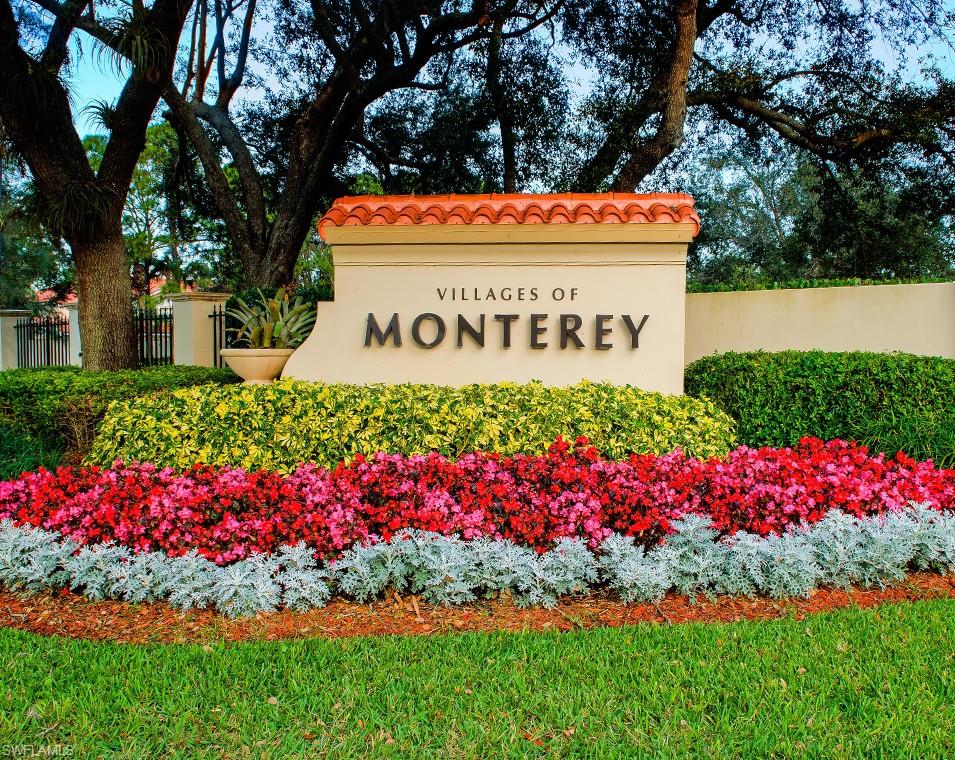 2067 Mission Drive Naples, FL 34109 - Photo 38 of 43 a sign that is in front of flowers