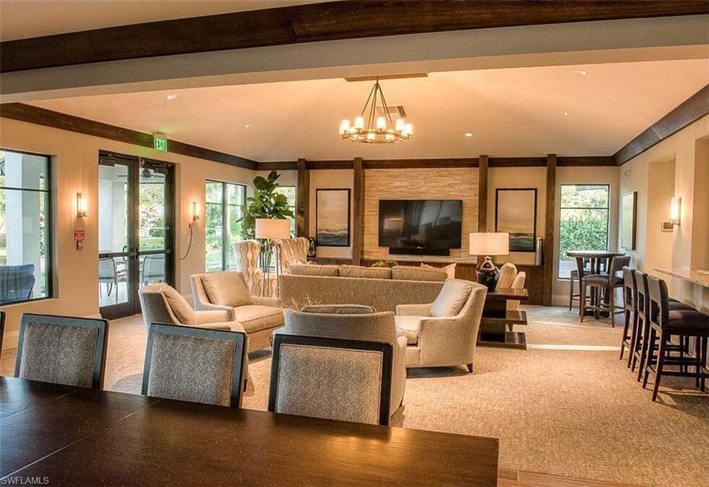 2067 Mission Drive Naples, FL 34109 - Photo 39 of 43 a living room with fireplace furniture and a large window