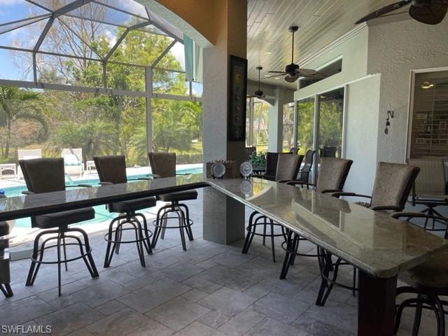 2067 Mission Drive Naples, FL 34109 - Photo 8 of 43 a dining room with furniture and window