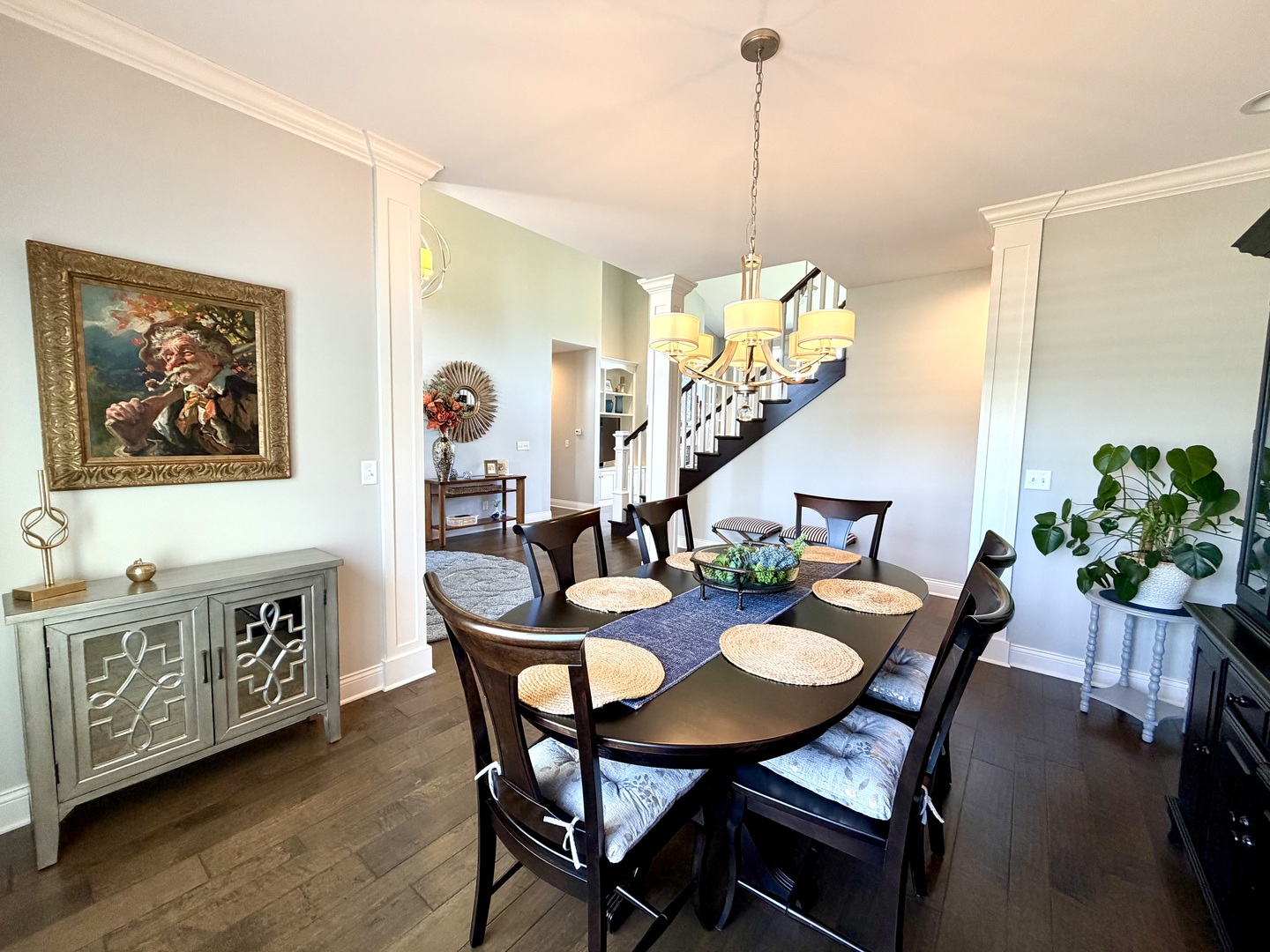 400 Constitution Boulevard Monticello, IL 61856 - Photo 11 of 58 a view of a dining room and livingroom with furniture wooden floor a chandelier