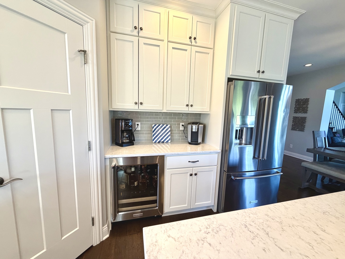 400 Constitution Boulevard Monticello, IL 61856 - Photo 20 of 58 a kitchen with stainless steel appliances granite countertop a refrigerator a stove and a sink with wooden cabinets